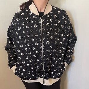 Black bomber with crescent shapes